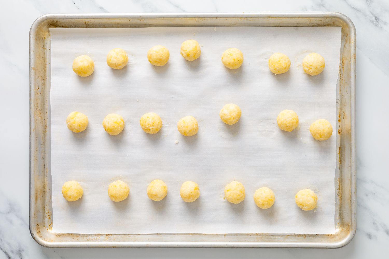 Mashed potato shaped into small truffles for potato candy recipe