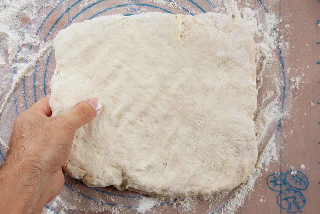 Pat down angel biscuit dough