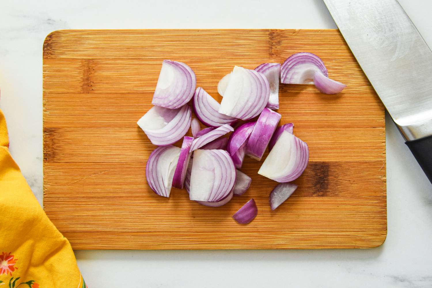 Red Onions Sliced on a Cutting Board for Daal Palak Recipe