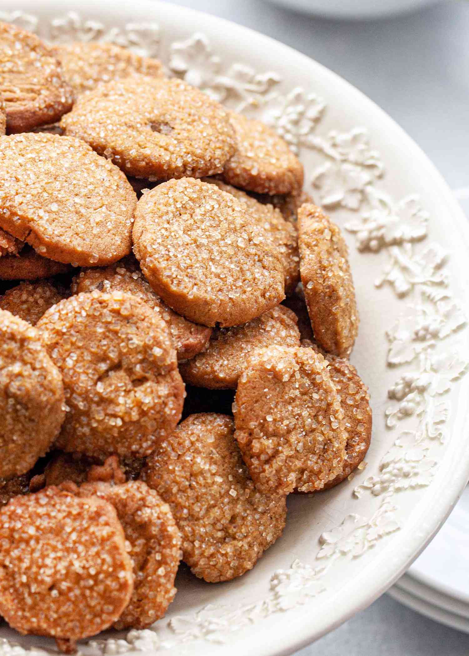 Close up of Make Ahead Slice and Bake Ginger Cookies in a footed serving bowl and coated with raw sugar.