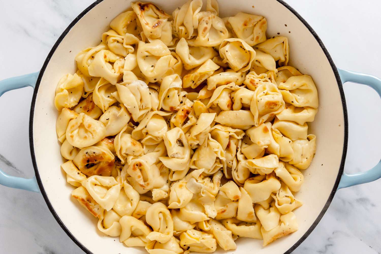 Pot of Skillet Cacio e Pepe Tortellini After Water Evaporated 