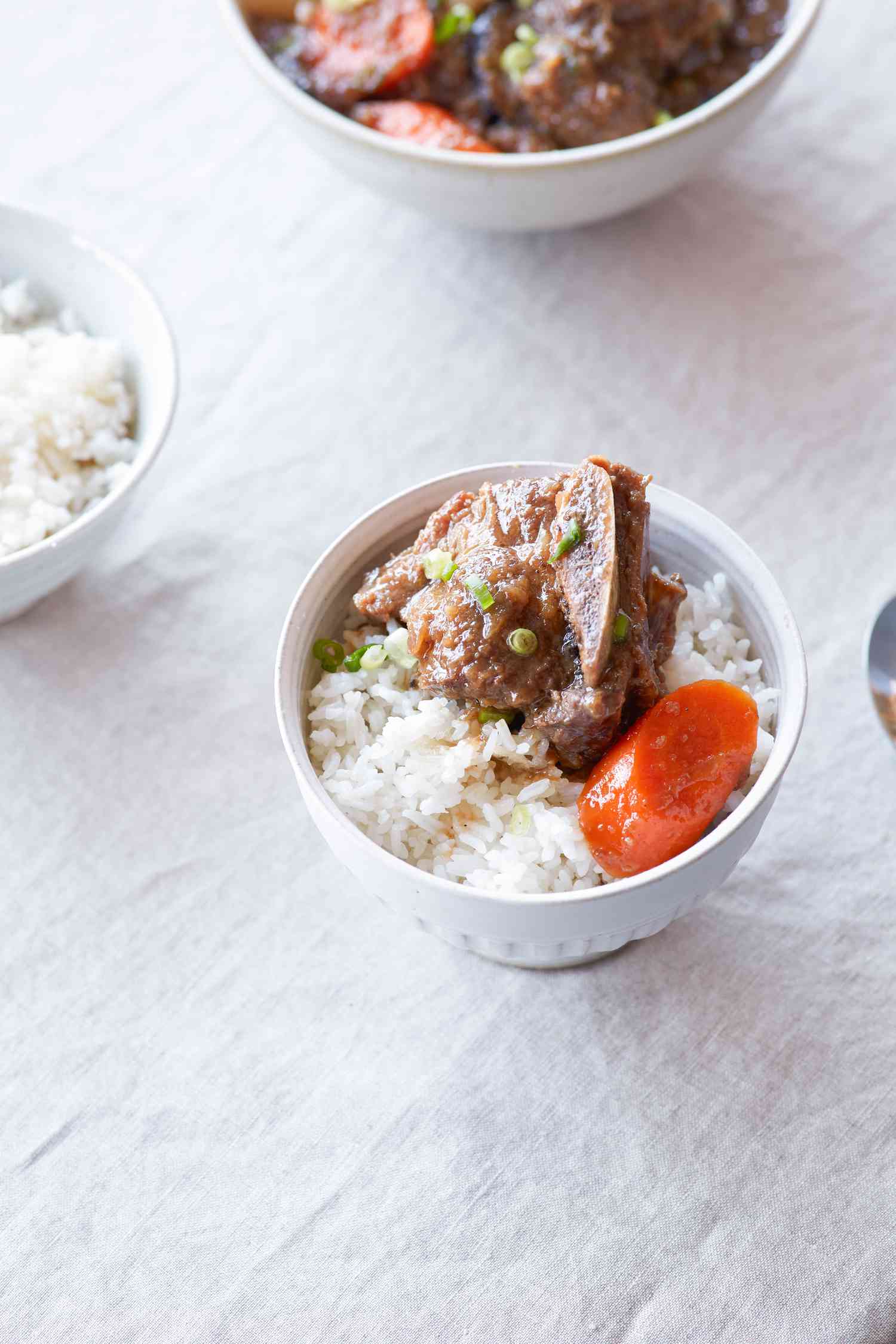 Galbi jjim (braised short ribs) in a bowl along with rice.
