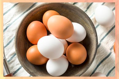 Brown eggs and white eggs in a bowl