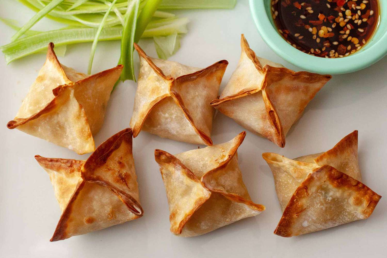 crab rangoon with dipping sauce on side