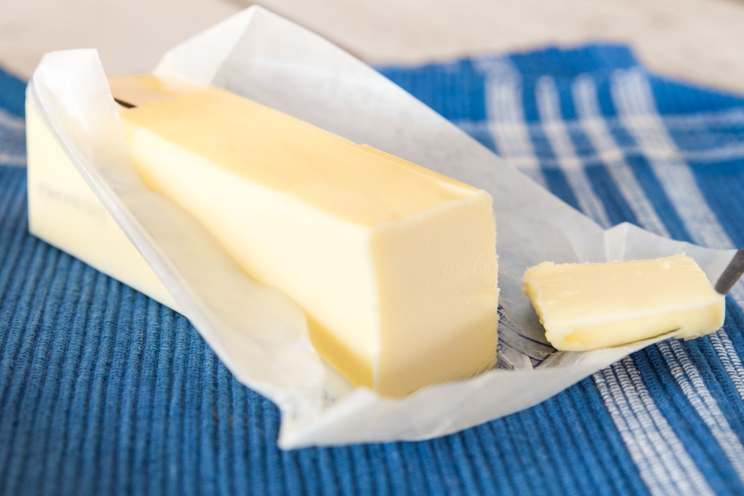 A stick of butter on the counter