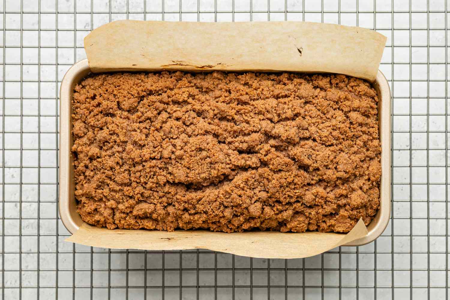 Baked Chocolate Chip Banana Bread Coffee Cake in Loaf Pan on a Cooling Rack 