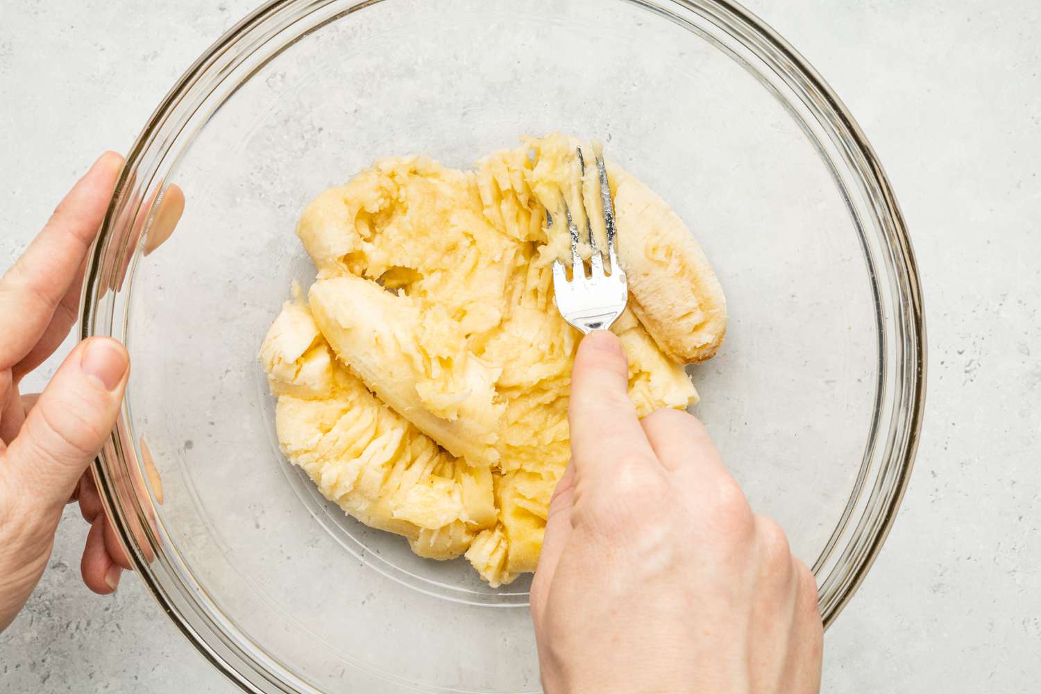 Fork Used to Mash Bananas in a Bowl for Banana Bread Coffee Cake Recipe