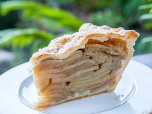 mile high apple pie on serving plate