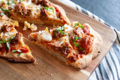 Slice of kimchi and sausage pizza.
