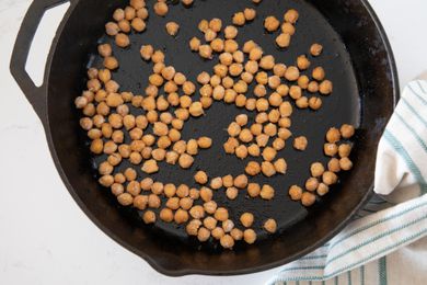 Crispy chickpeas in a black cast iron skillet