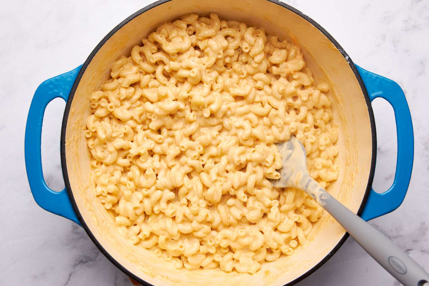 One pot mac and cheese ingredients all mixed together in the dutch oven