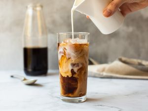 Creamer Poured into a Glass of Cold Brew Coffee