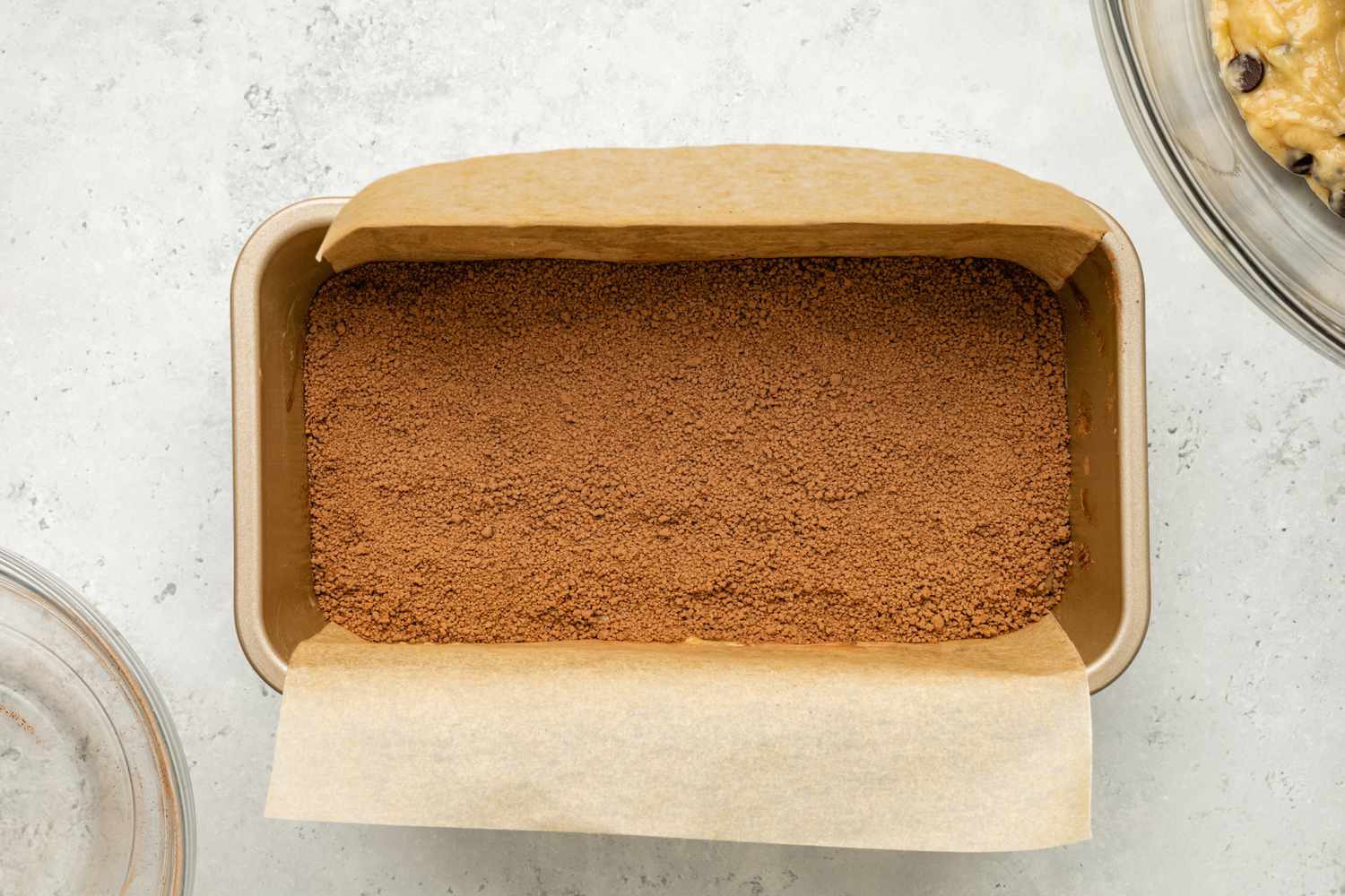 Filling Added Above Chocolate Chip Banana Bread Coffee Cake Layer in Loaf Pan