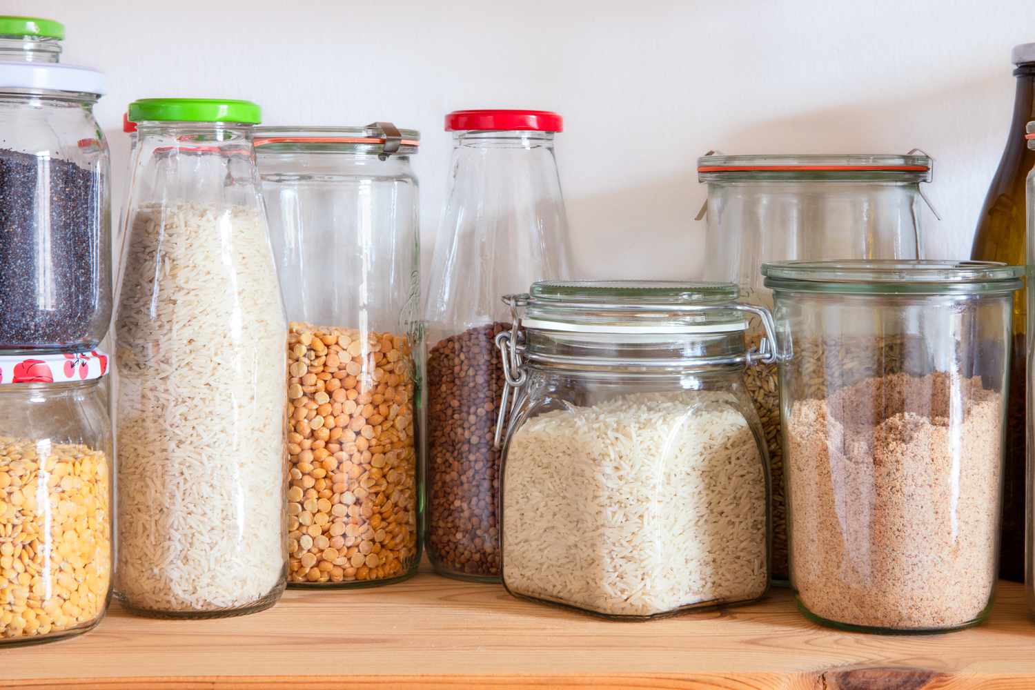 Jars of dried foods (rice, beans, flour, and lentils)