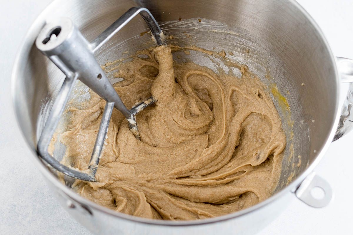 Batter in a metal bowl for homemade chocolate chip cookies.
