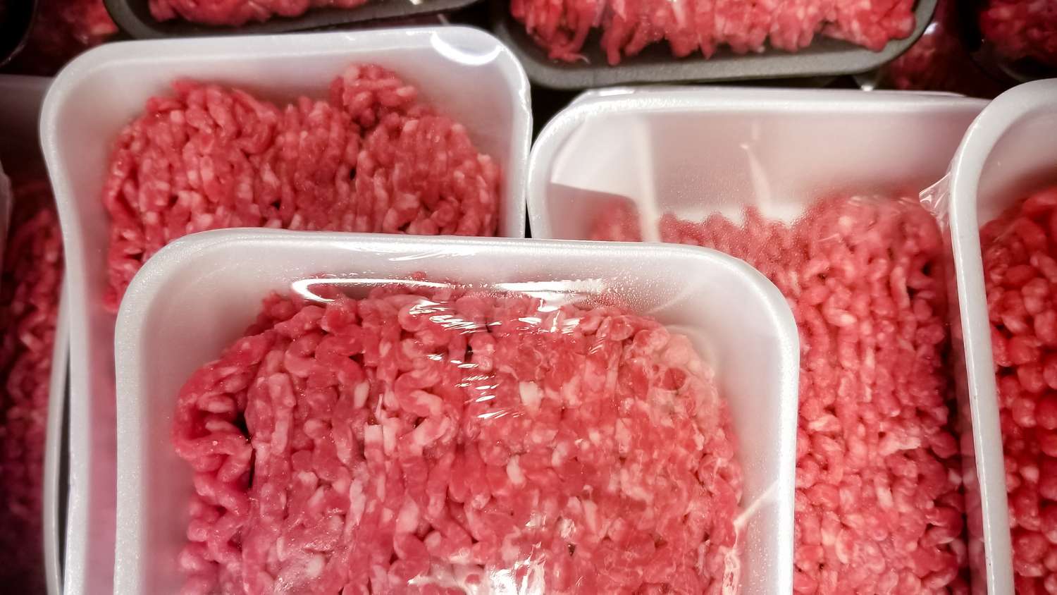 Packages of ground beef shown wrapped and close up