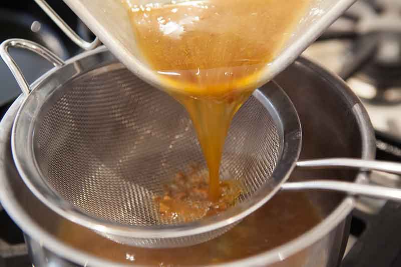 pan sauce poured through sieve