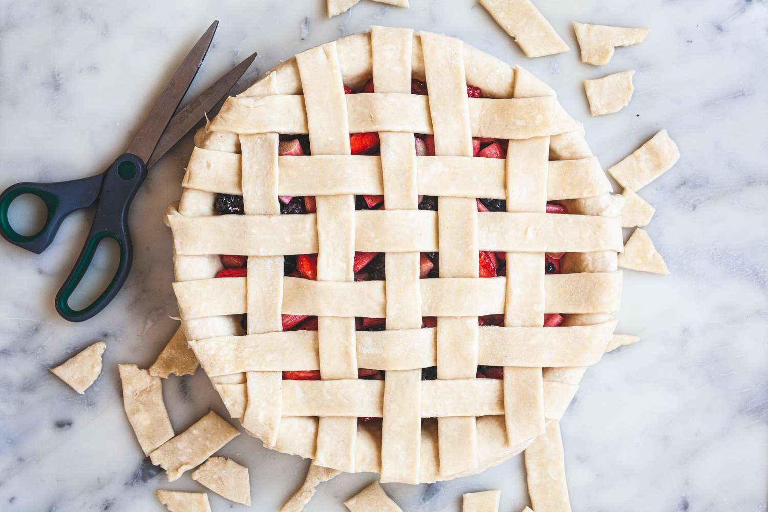 Weaving the strips of a lattice pie crust.