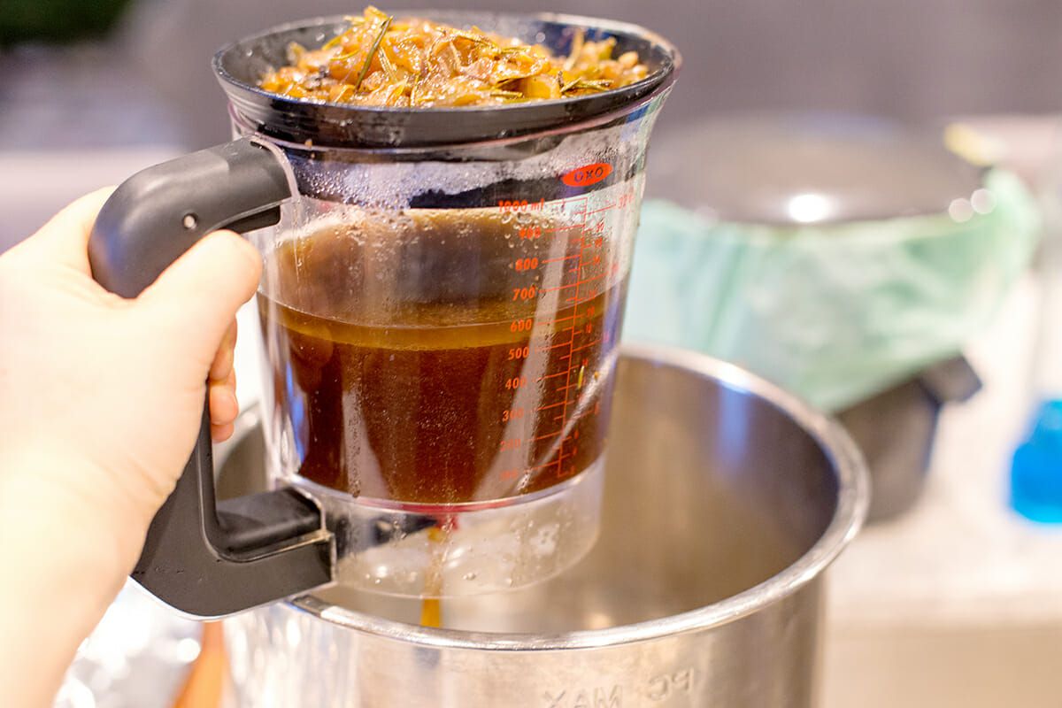 strain to separate the liquid and the cooked vegetables for the pot roast