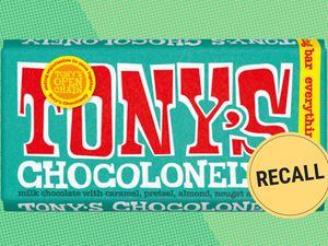 Tony's Chocolonely Everything Bar on a green speckled background with a round RECALL sticker on the lower right of the image