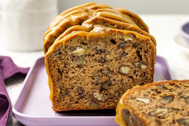 Sliced Banana Pecan Bread With Caramelized White Chocolate Sorghum Glaze on a Platter