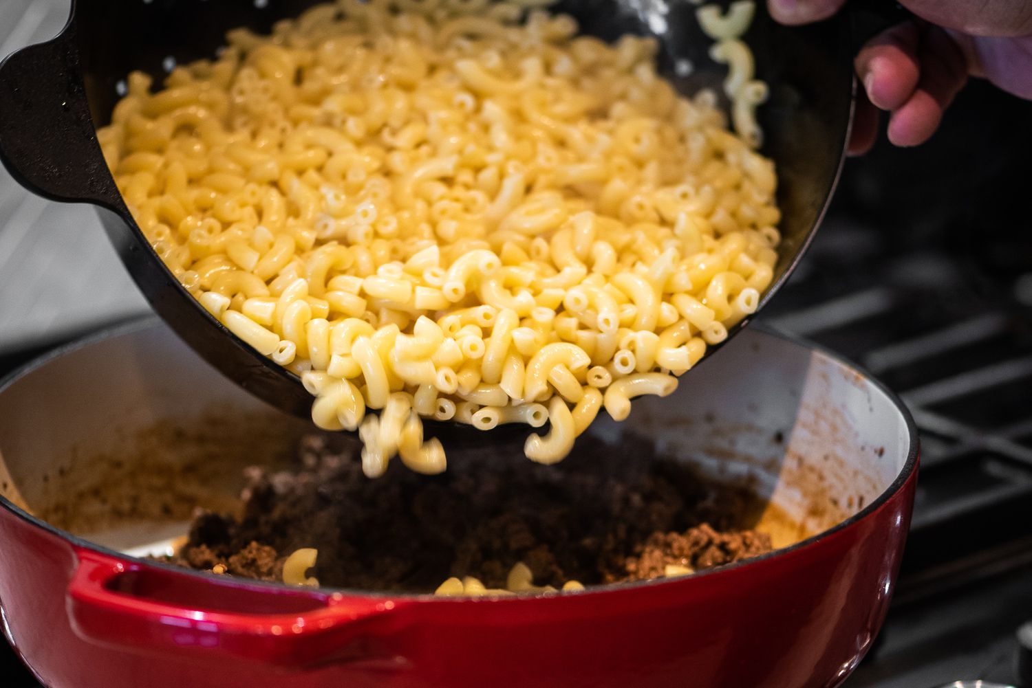 Cooked Pasta Added to Dutch Oven with Cooked Ground Beef 