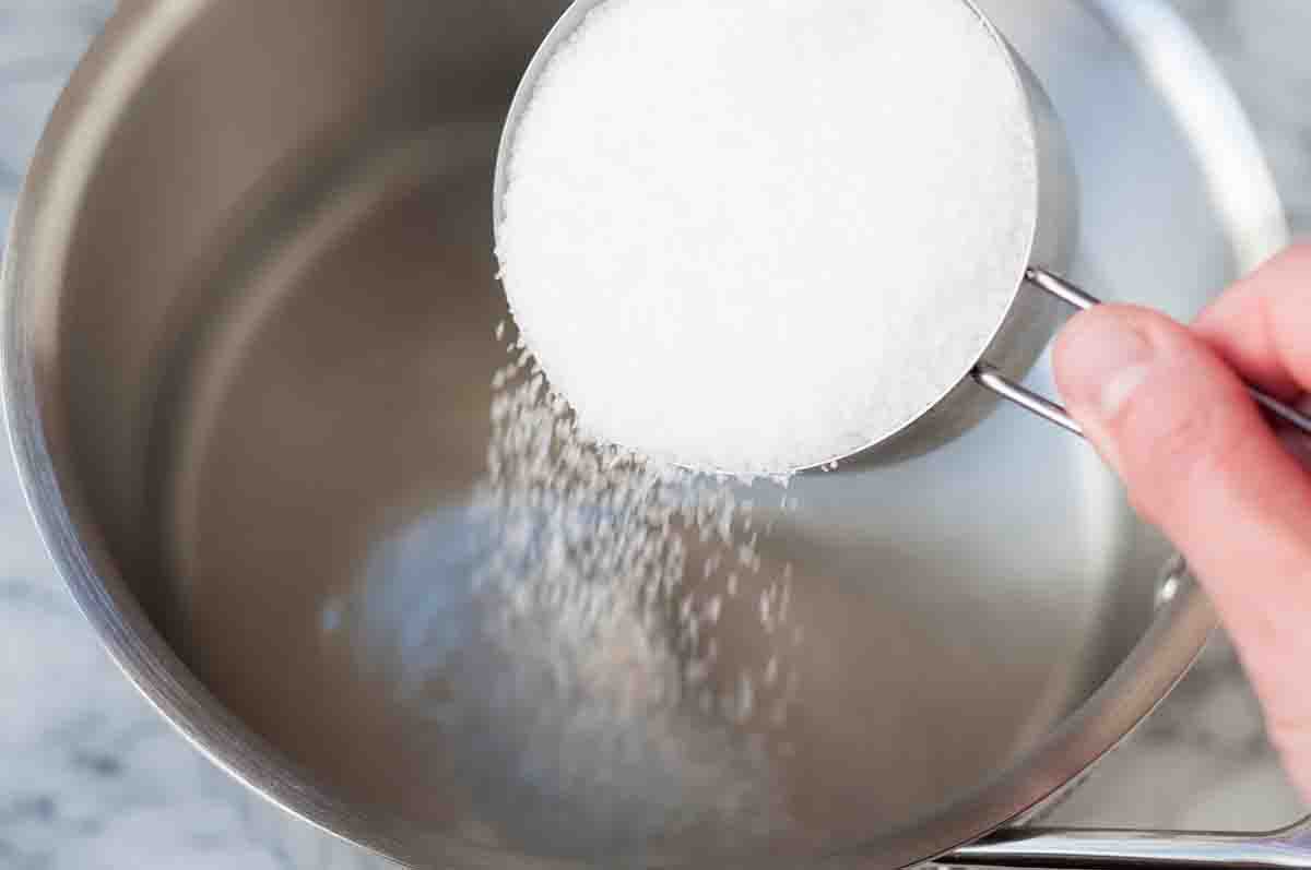 Easiest Turkey Brine Ever adding salt to the pot
