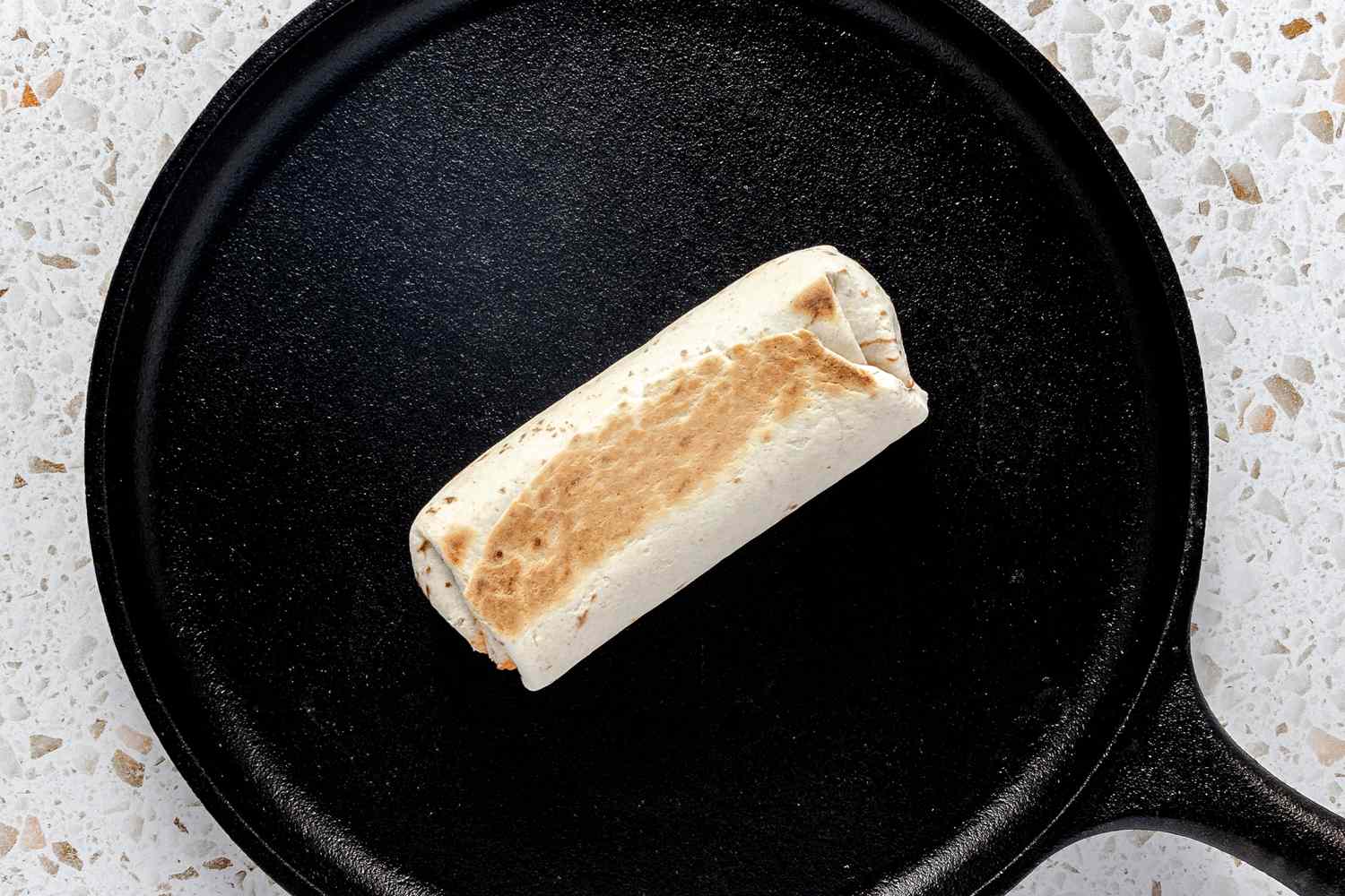 Heating Burrito on a Cast Iron Griddle for Easy Freezer Burrito Recipe 