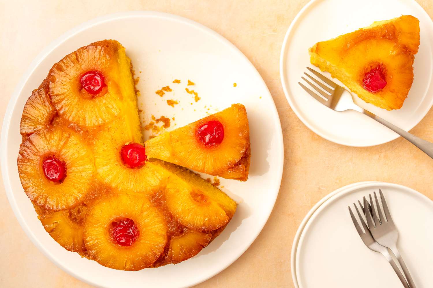 Easy Pineapple Upside Down Cake, one slice removed and plated