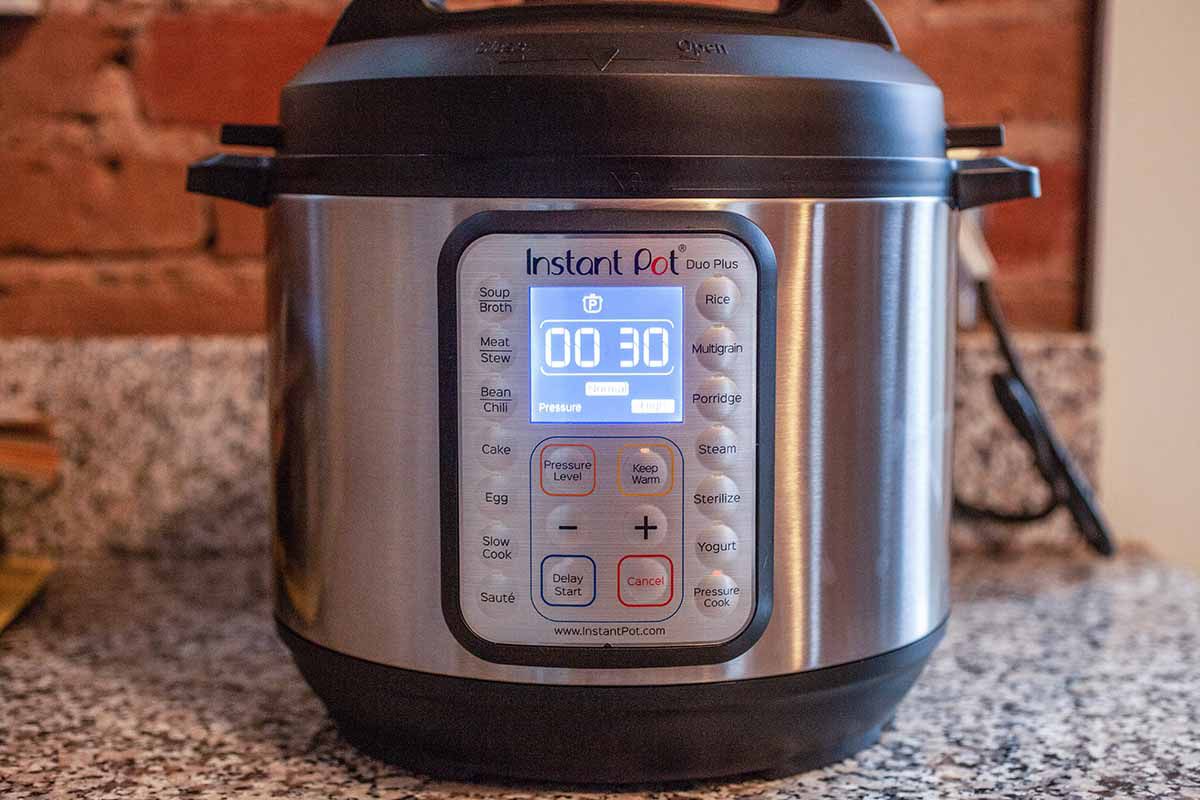 How to Make Chicken Stock in the Instant Pot - an instant pot with the digital timer reading 30 minutes