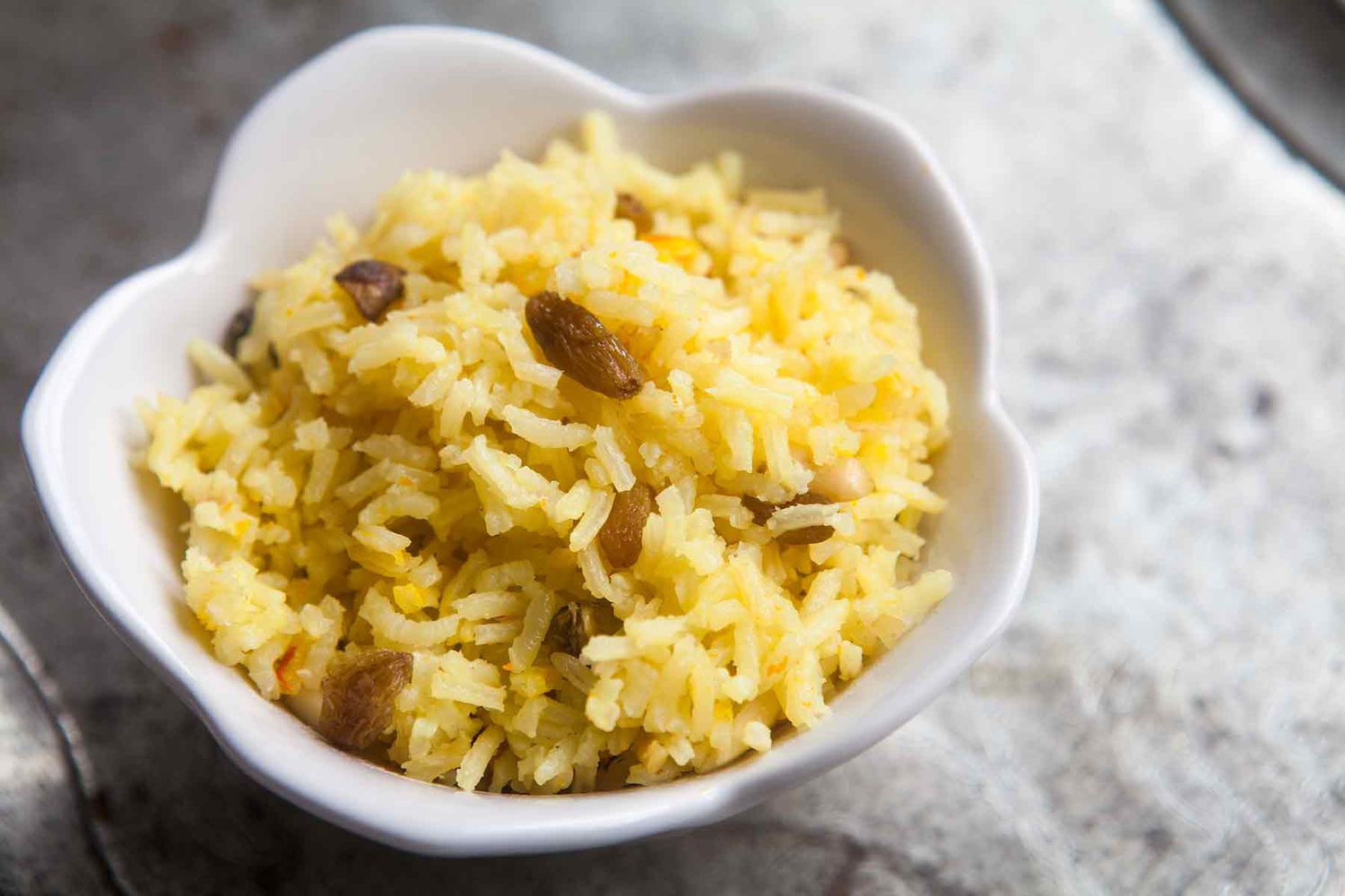 Saffron rice in small single serving bowl 