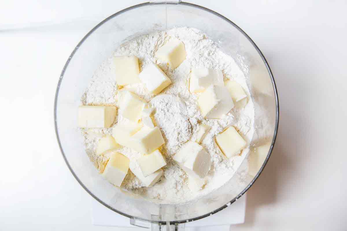 Butter and flour in a food processor to make a crust
