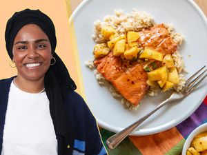 Nadiya Hussain next to a plate of salmon with fruit on rice