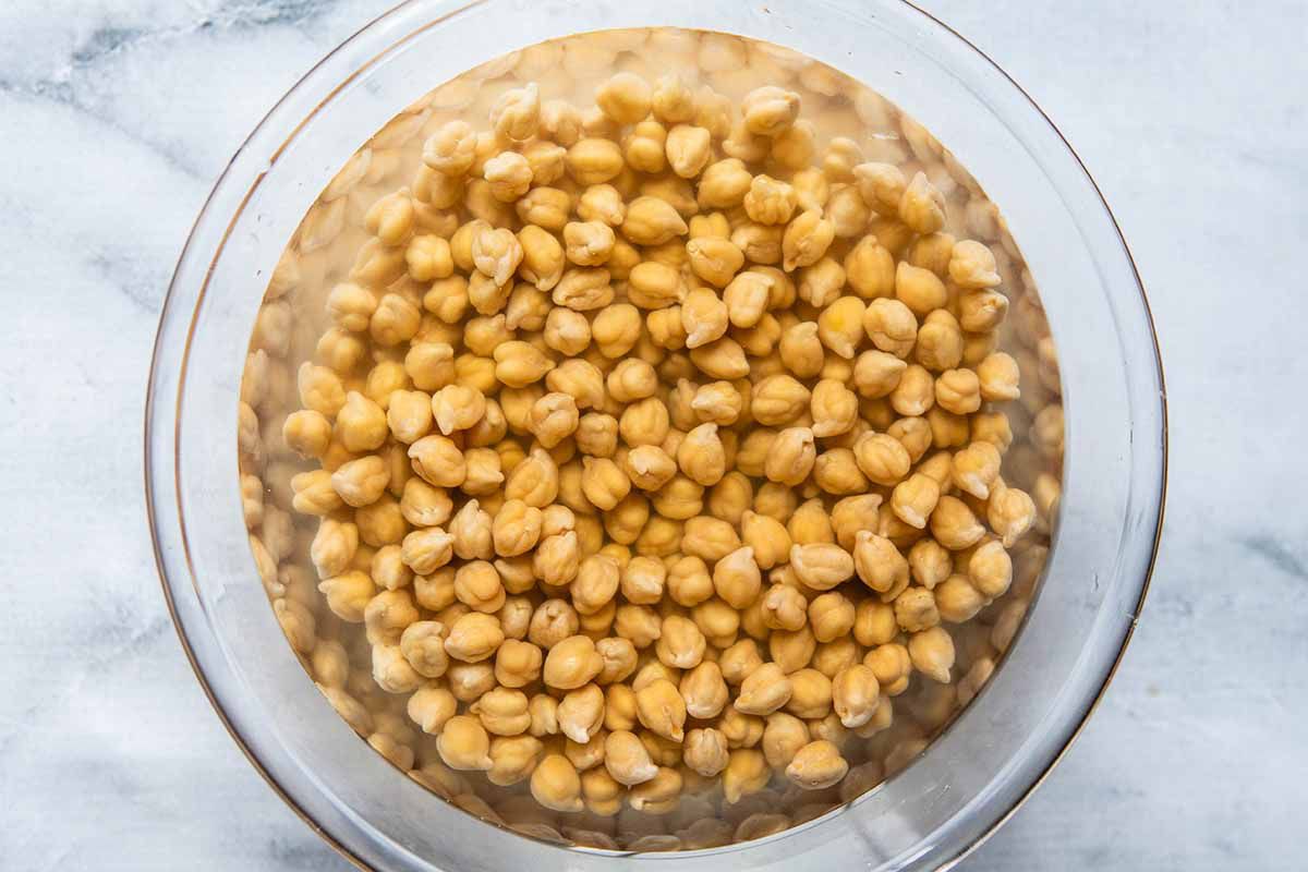 Best Chana Masala - chickpeas soaking in a bowl of water