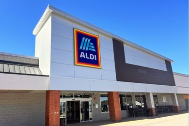 Facade of an ALDI store with the company logo displayed above the entrance