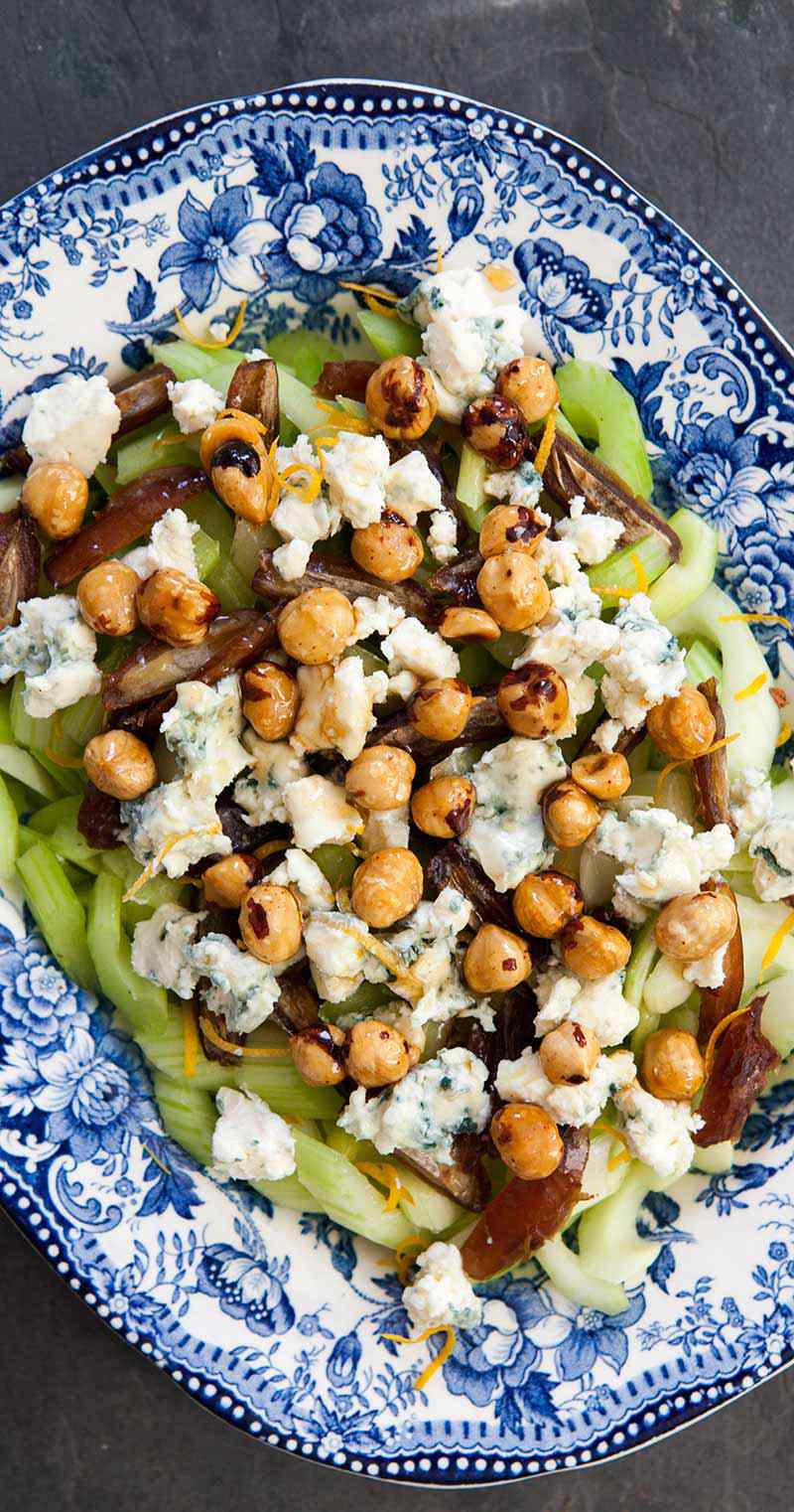 celery blue cheese and hazelnut salad on a blue decorative plate