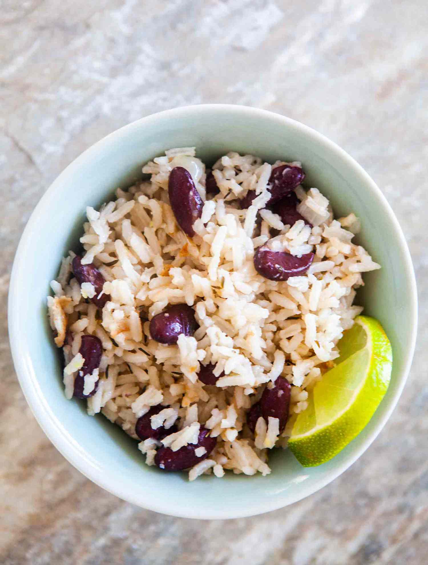 Coconut rice and beans with a lime wedge