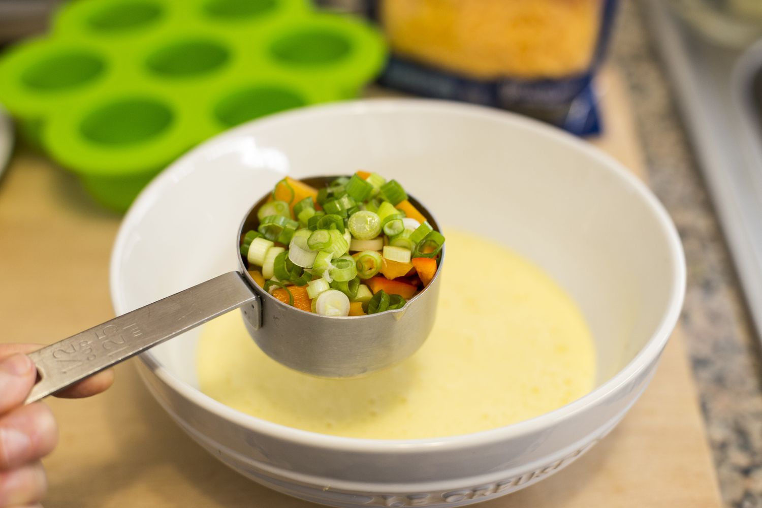 Add the veggies to the egg mixture for making the starbucks egg bites sous vide in the instant pot
