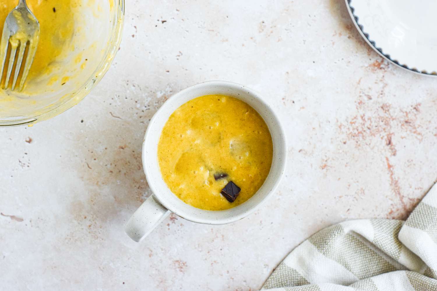 Banana Bread Chocolate Chunk Mug Cake Batter in a Microwave Safe Mug 