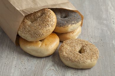 a paper bag of bagels