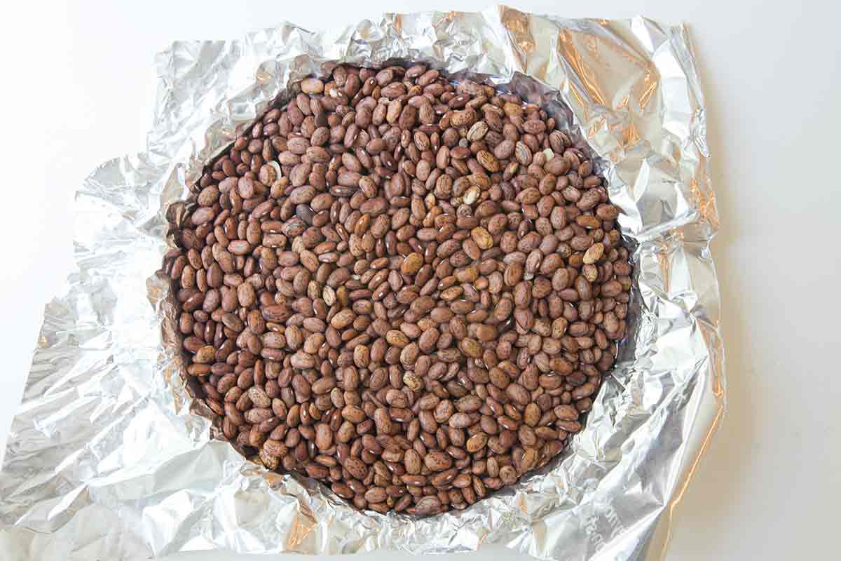 Beans in a tart pan to blind bake a crust
