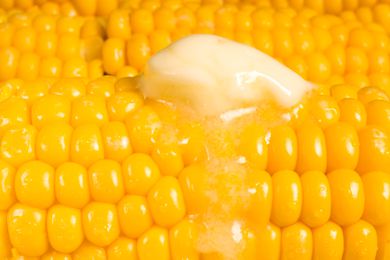 corn on the cob with a dollop of melting butter (close-up)