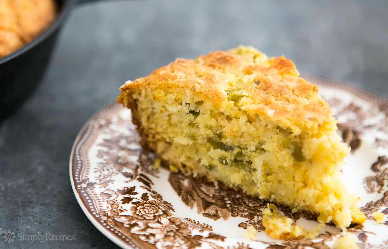 slice of jalapeno cornbread on a decorative plate