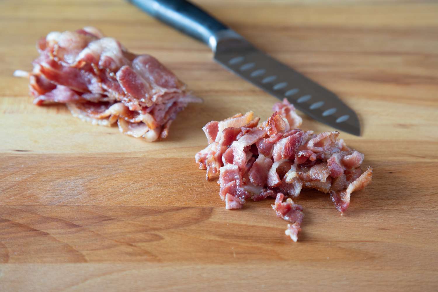 Chopping bacon for a quiche lorraine recipe.