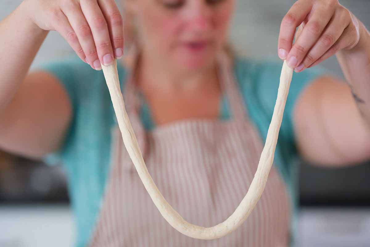 Lift each rope by the ends, letting the middle droop down