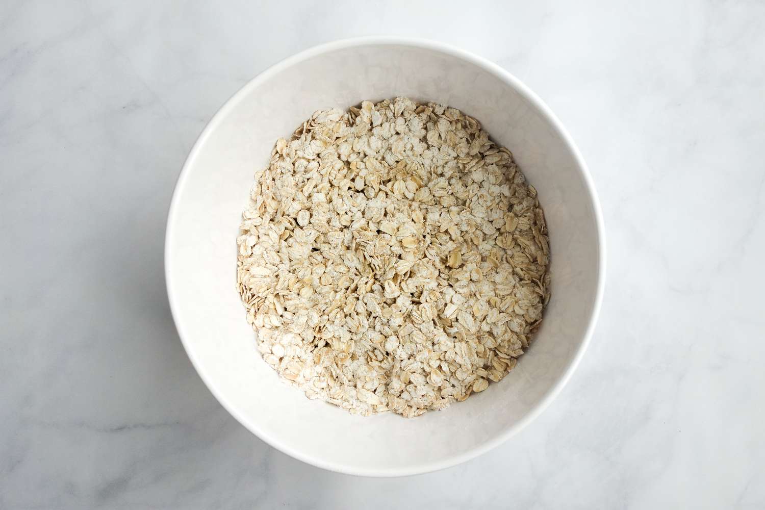 Bowl of Oats for Chewy Peanut Butter Oatmeal Cookies