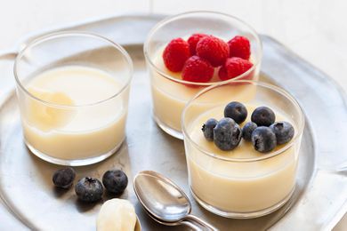 Easy Lemon Pudding in three cups topped with berries