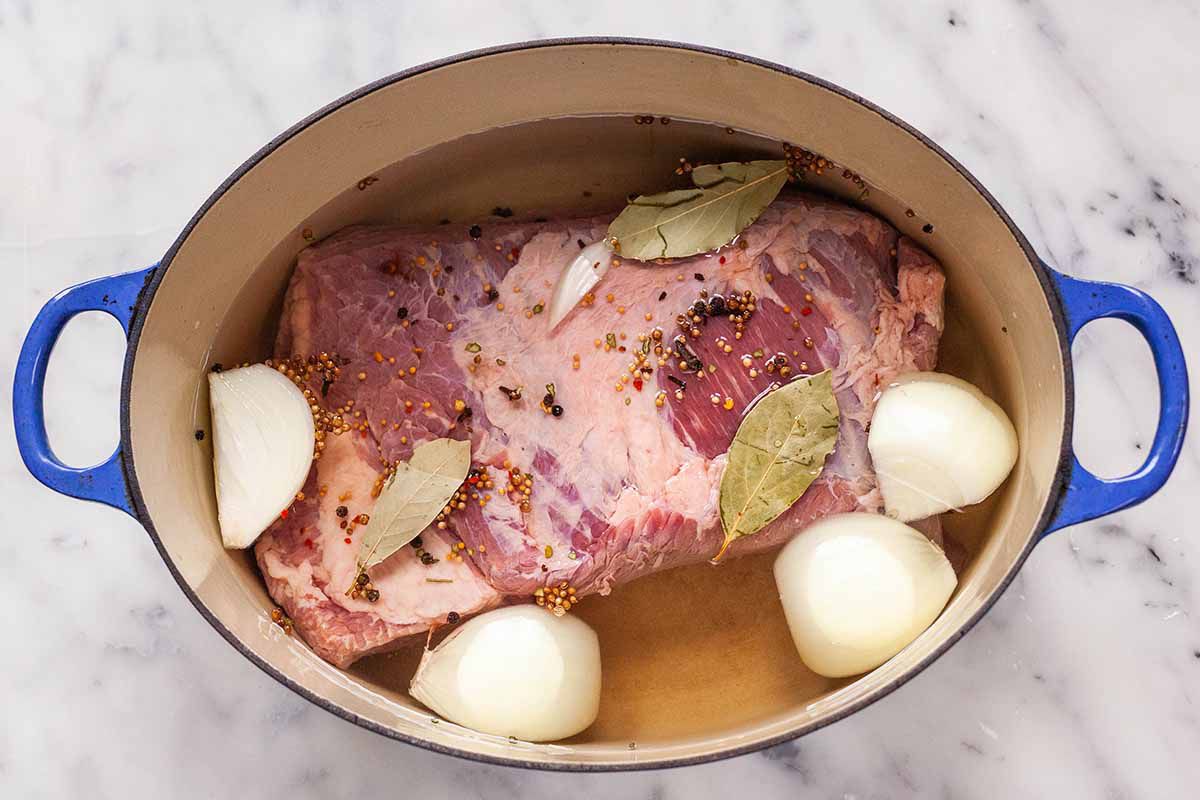 How to Make Corned Beef and Cabbage - corned beef, and potatoes in a pot