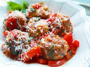 Turkey Meatballs with Tomatoes and Basil in a white bowl