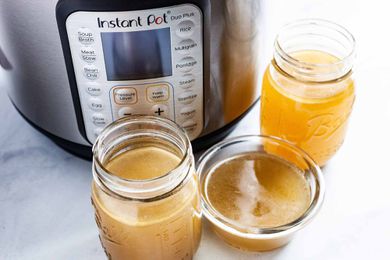 Instant Pot Chicken Stock - jars filled with chicken stock 